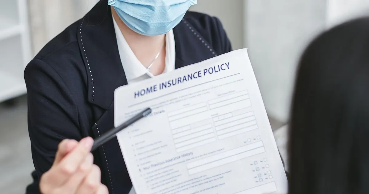 HR professional reviewing employee benefits policy with an employee