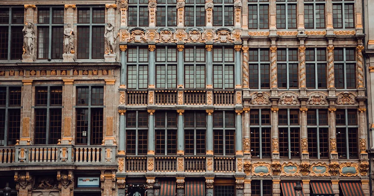 Grand Place in Brussels with historic guild houses, symbolising Belgian enterprise expanding to hire Indian employees