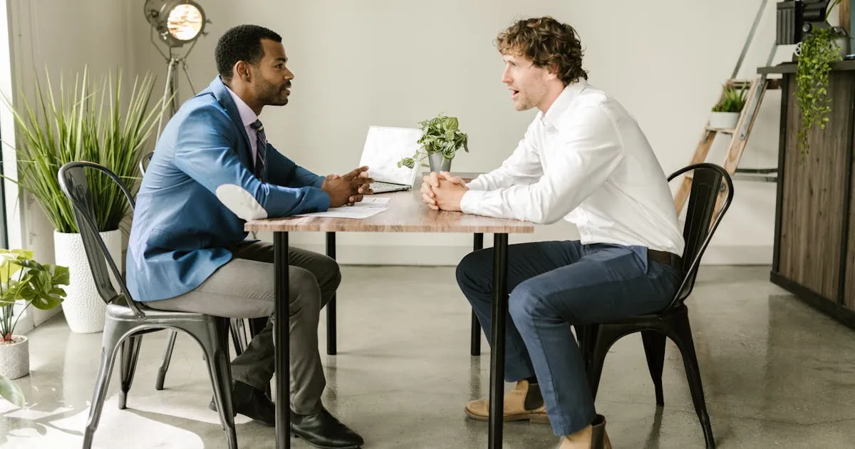 HR manager reviewing onboarding checklist with a new joiner
