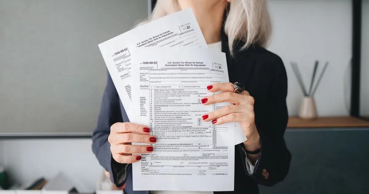 Professional reviewing tax documents for state professional tax filing