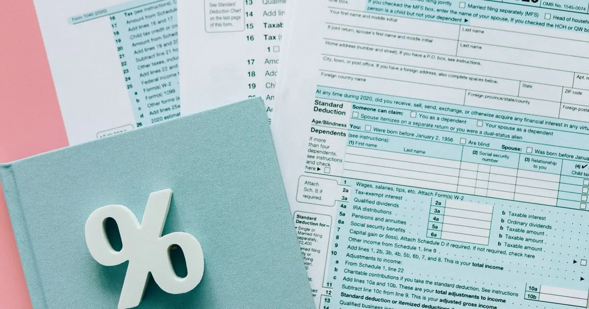 Tax documents with percentage symbol, TDS deduction at source