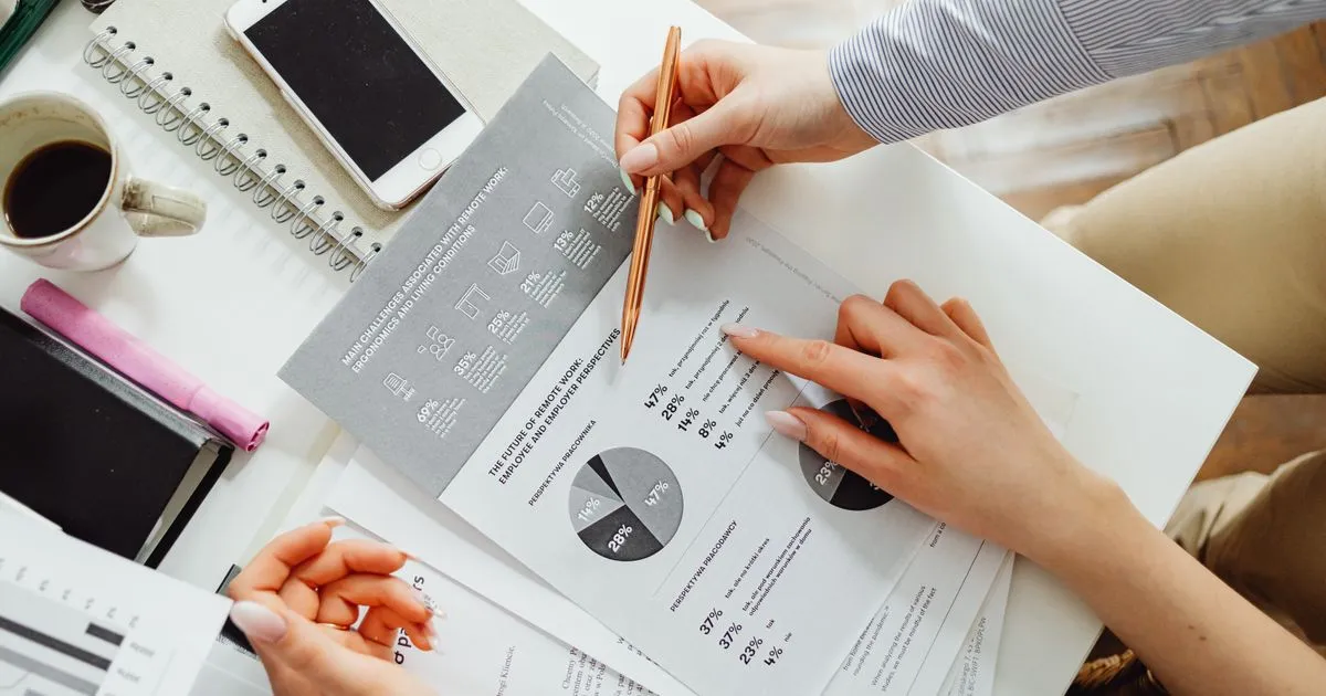 A US HR lead reviewing contractor files and audit documents